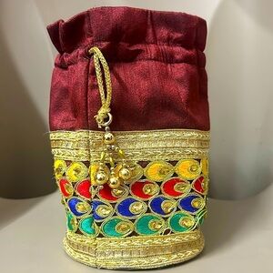 Beaded peacock colored jewelry bag